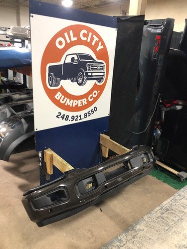 Darkened Bronze 2023-2026 Ford F250 F350 front bumper OEM with sensor